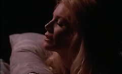 Shannon Tweed bent over a pool table as a guy has sex with