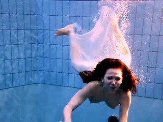 Andrea shows nice body underwater