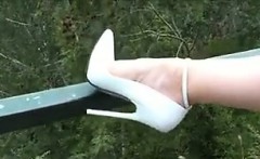 Very Tall And White High Heels Outdoors