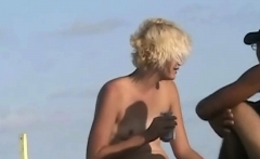 Naked hotties followed around by a nude beach voyeur