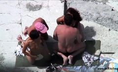 Public foursome at the nude beach