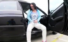 Masturbating bringing herself to orgasm in the Parking lot