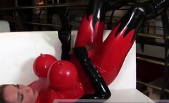 Blonde tranny in inflatable latex outfit enjoys solo